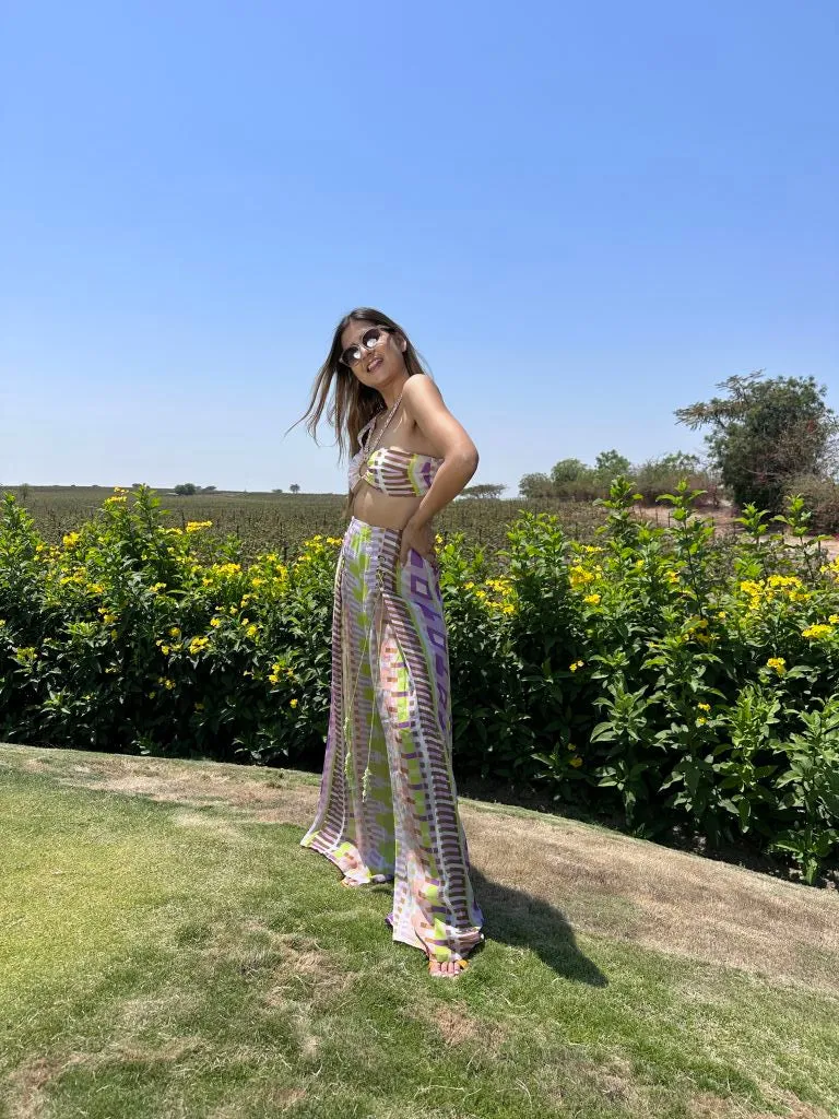 Deepika Ghose Geometric Printed Bralet with Hand Embroidered Straps and Center Ring detailing and Geometric Printed Flared Pants with Rivet Detailing from Magical Wilderness Collection