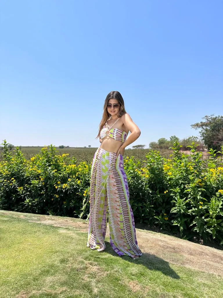 Deepika Ghose Geometric Printed Bralet with Hand Embroidered Straps and Center Ring detailing and Geometric Printed Flared Pants with Rivet Detailing from Magical Wilderness Collection