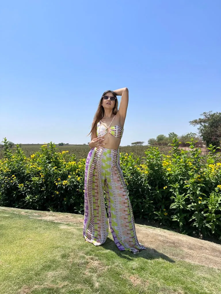 Deepika Ghose Geometric Printed Bralet with Hand Embroidered Straps and Center Ring detailing and Geometric Printed Flared Pants with Rivet Detailing from Magical Wilderness Collection